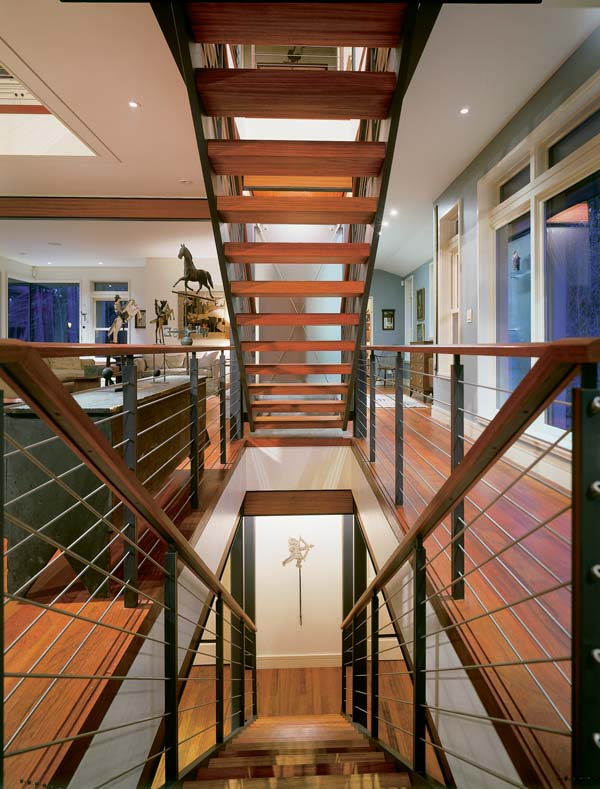 Tony and Sally's antique Colonial furniture contasts with sleek 21st-century steel beams.